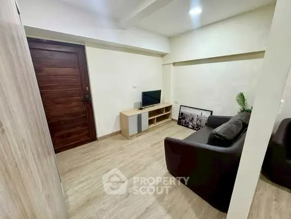 Cozy living room with modern furniture and wooden flooring