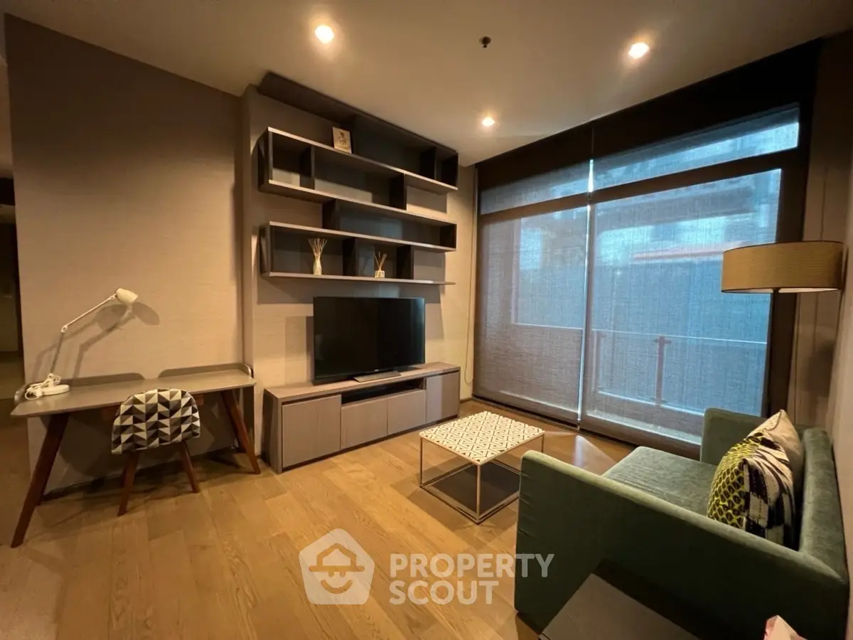 Modern living room with stylish furniture and large window view