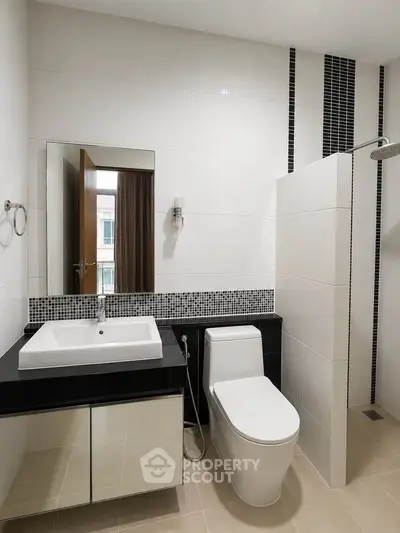Modern bathroom with sleek fixtures and stylish tile accents