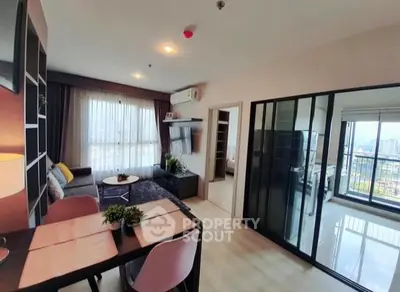 Modern living room with open layout and balcony view in stylish apartment