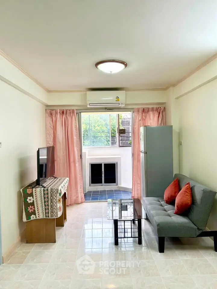 Bright living room with modern decor and large window view