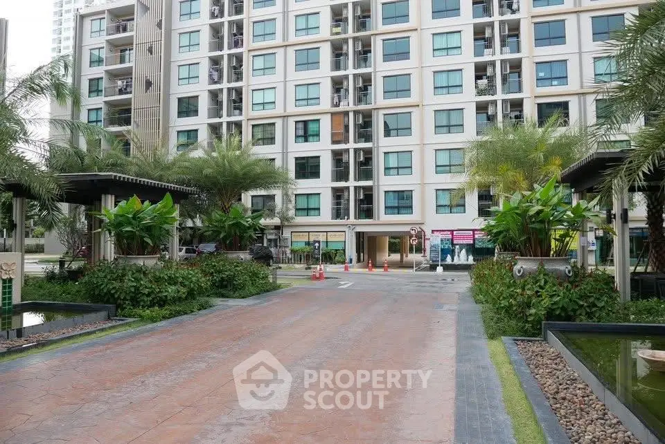 Modern residential building with lush landscaping and spacious entrance