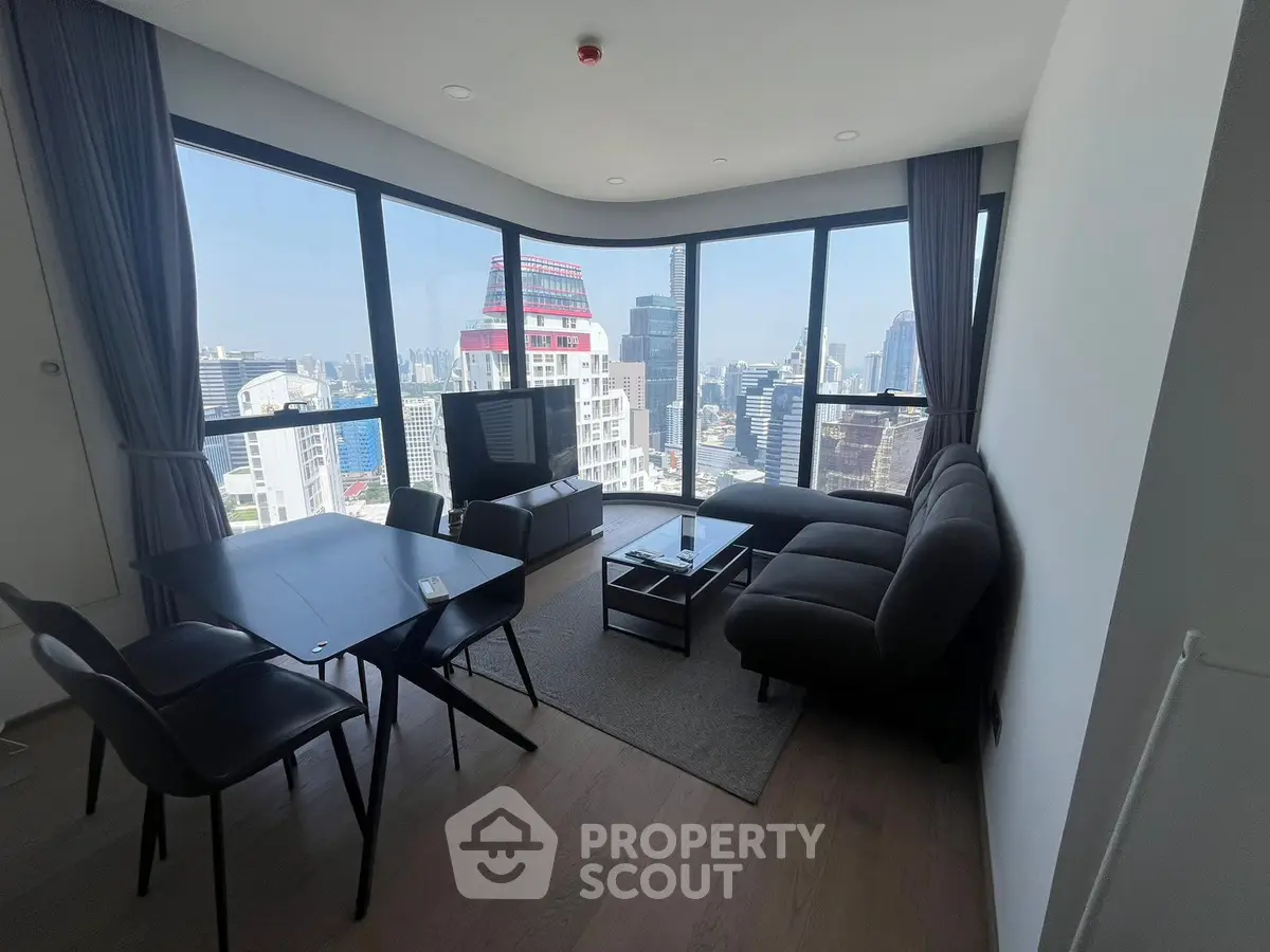 Stunning corner unit living room with panoramic city views and modern furnishings.