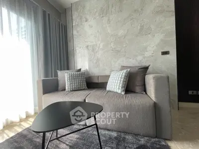 Modern living room with stylish sofa and natural light