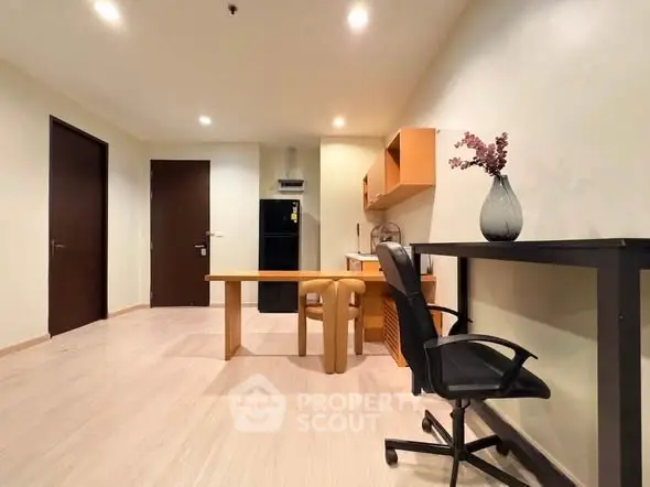 Modern study room with sleek furniture and ample lighting, perfect for productivity and comfort.