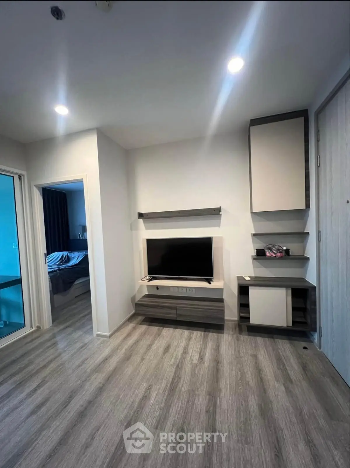 Modern living room with sleek TV unit and stylish flooring