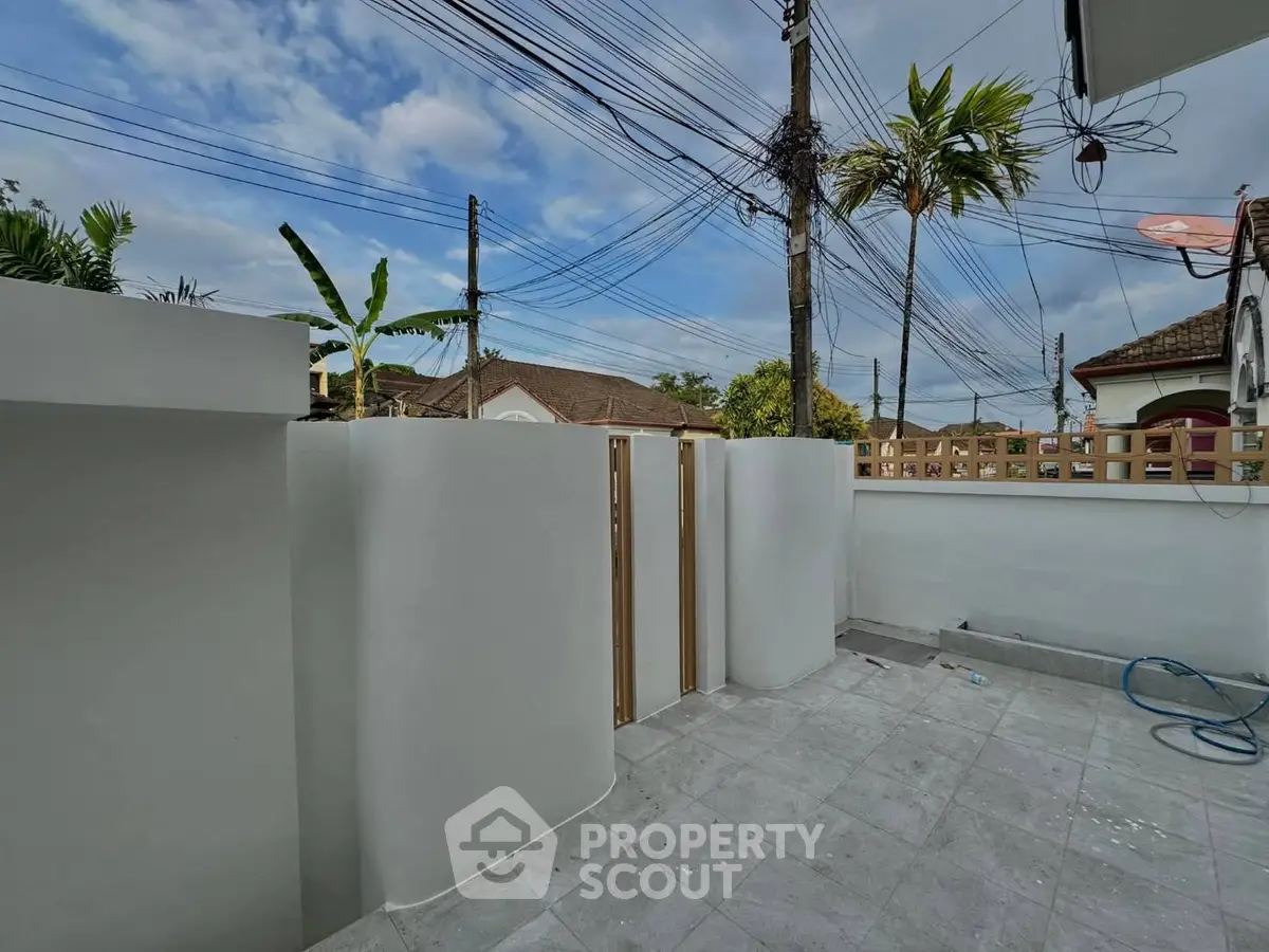 Spacious outdoor patio with modern design and clear sky view