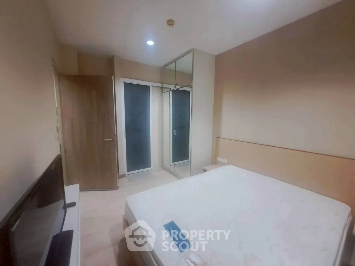 Modern bedroom with minimalist design and built-in wardrobe