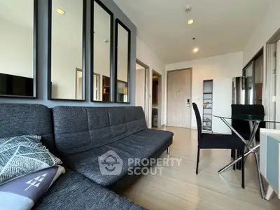 Modern living room with stylish decor and comfortable seating in a contemporary apartment.