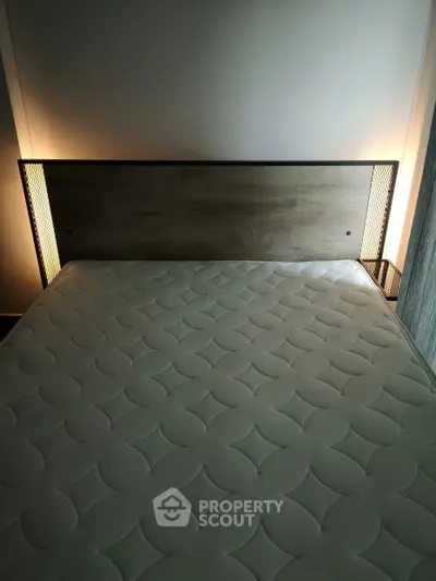 Modern bedroom with stylish headboard and ambient lighting