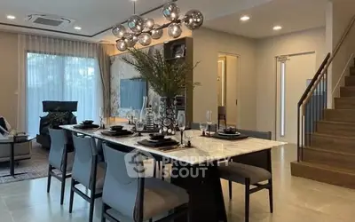Luxurious dining area with modern decor and elegant lighting in a stylish home interior.