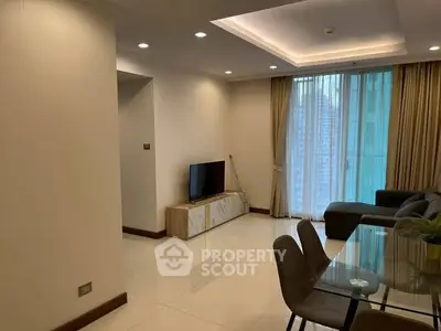 Spacious modern living room with elegant dining area and large windows.