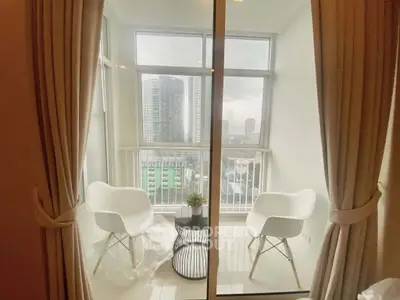 Chic balcony with modern chairs and city view, perfect for relaxation and enjoying urban scenery.