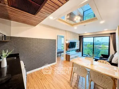Modern living room with open layout, stylish decor, and large windows offering a stunning view.