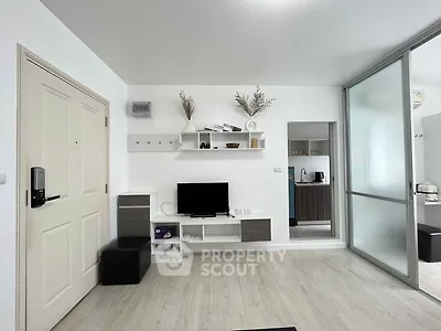 Modern living room with sleek design and open kitchen layout