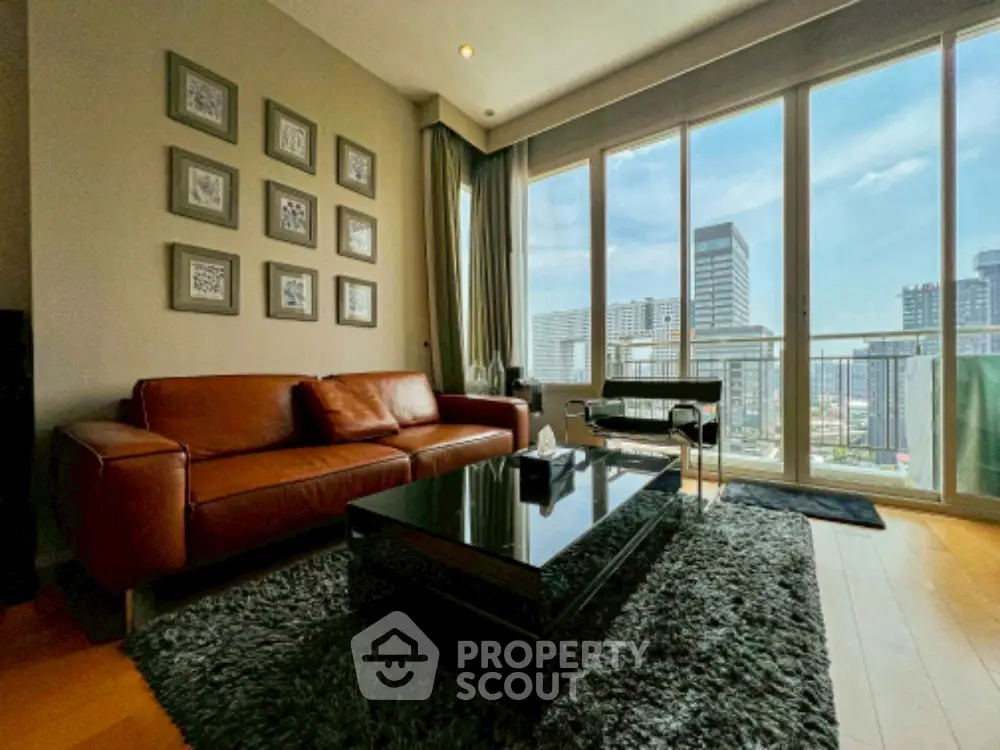 Modern living room with leather sofa and city view from large windows