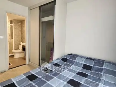 Modern bedroom with ensuite bathroom and sliding closet doors