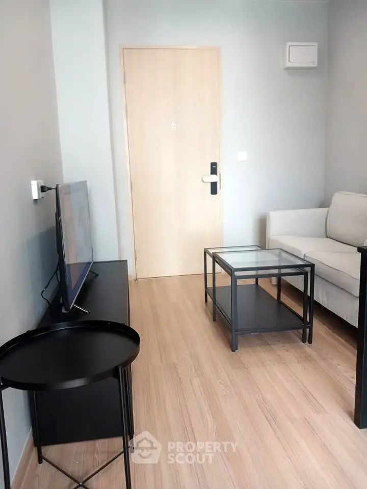 Modern living room with sleek furniture and wooden flooring