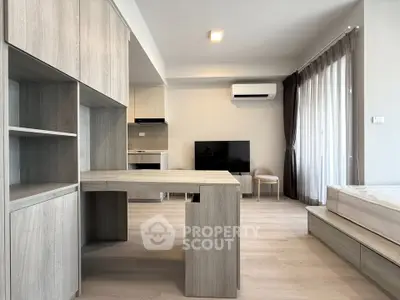 Modern living room with sleek furniture and natural light, featuring a stylish open layout and contemporary design.