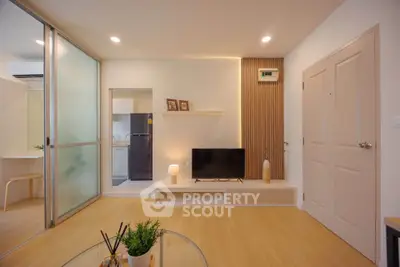 Modern living room with sleek design and open layout, featuring stylish decor and ample natural light.