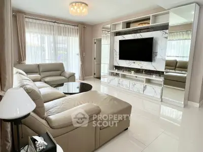 Luxurious modern living room with elegant marble TV wall and plush leather seating.
