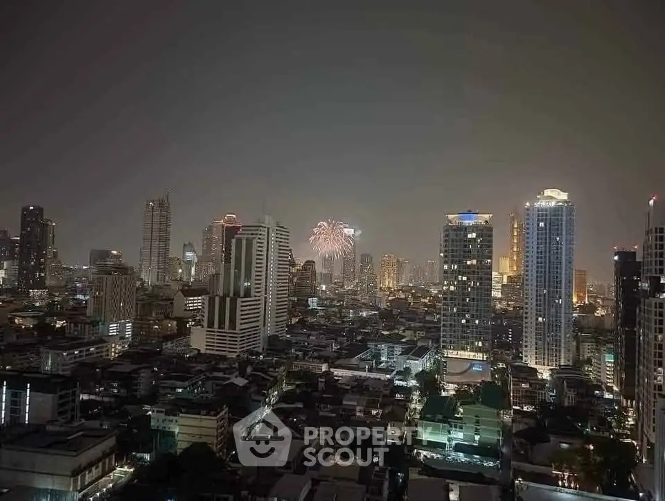 Stunning city skyline view with fireworks illuminating the night sky, showcasing urban living at its finest.