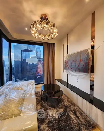 Luxurious living room with stunning city view and elegant chandelier