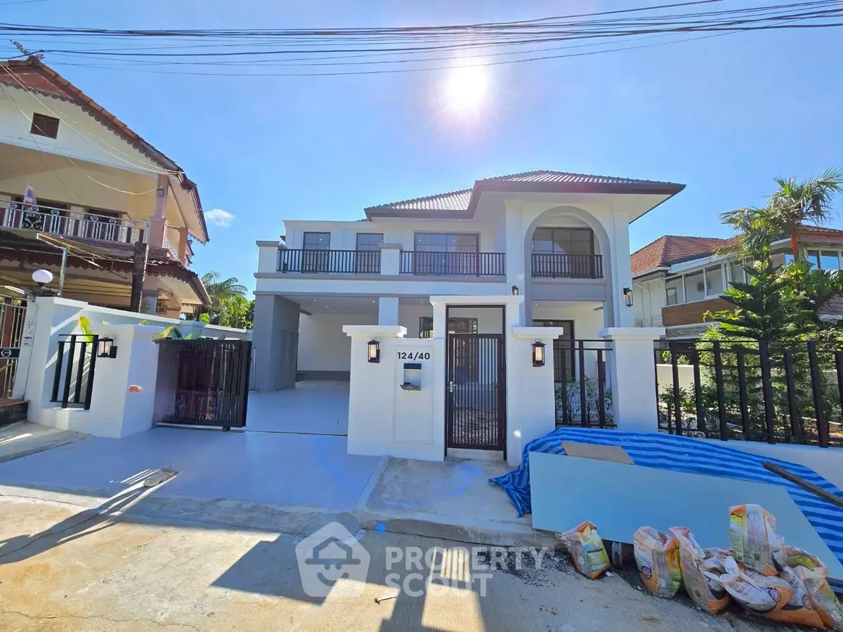 Stunning two-story house with modern design and spacious driveway in a sunny neighborhood.