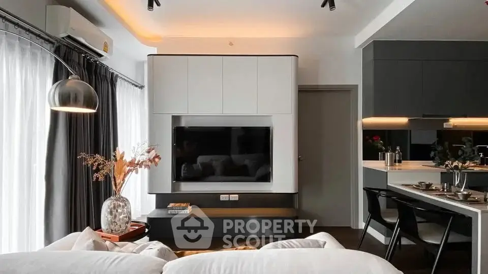 Modern living room with sleek design and open kitchen layout