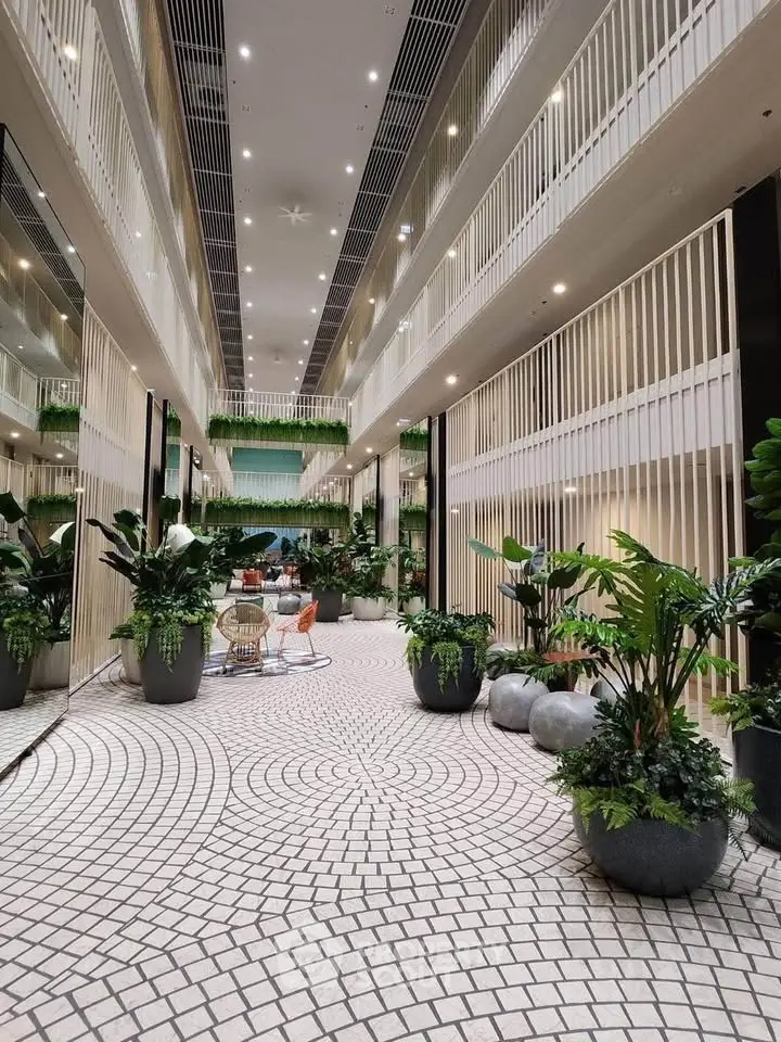 Luxurious modern building interior with lush greenery and elegant design