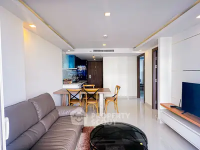 Modern living room with open kitchen and stylish furniture