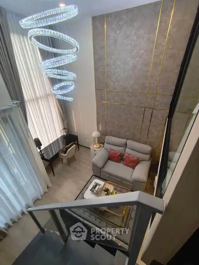 Luxurious modern living room with high ceiling and elegant spiral chandelier