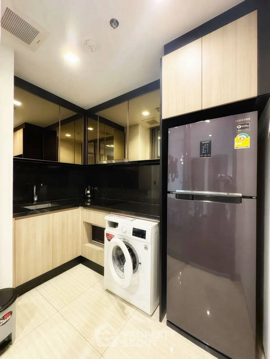 Modern kitchen with sleek appliances and ample storage space