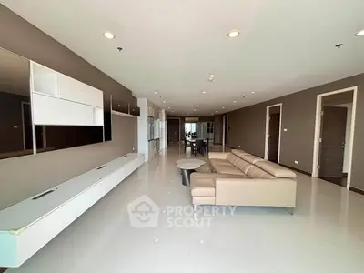 Spacious modern living room with sleek design and ample natural light