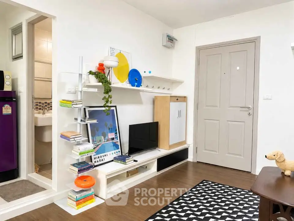 Modern living room with stylish shelving and decor, featuring a cozy atmosphere and sleek design.