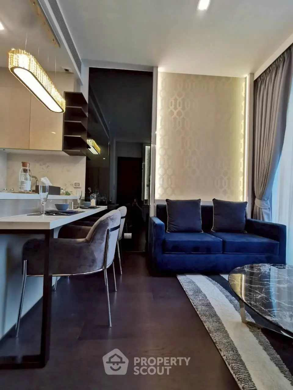 Luxurious modern living room with elegant decor and open kitchen layout