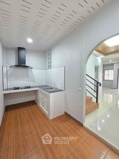Modern kitchen with gas stove and sleek design in open layout