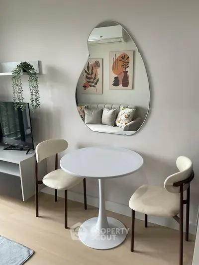 Chic modern living room with stylish furniture and unique mirror design