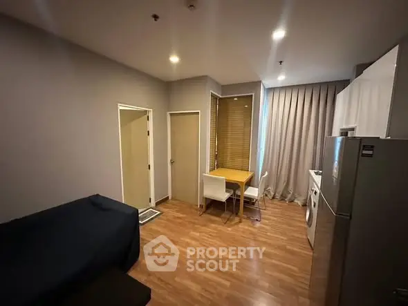 Modern studio apartment with open layout and hardwood floors