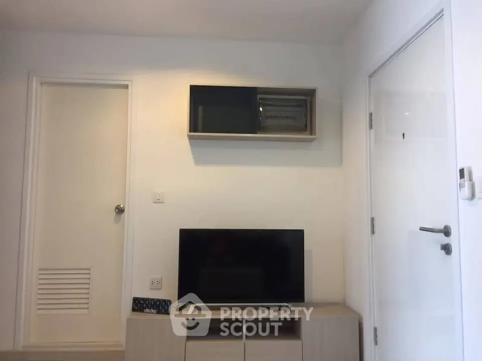 Modern living room with sleek TV setup and minimalist decor