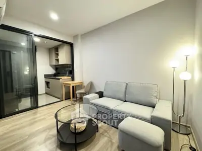 Modern living room with cozy sofa and open kitchen layout