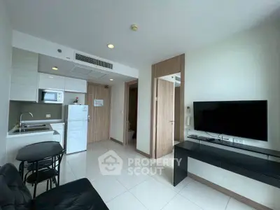 Modern apartment living room with sleek kitchen and stylish furnishings