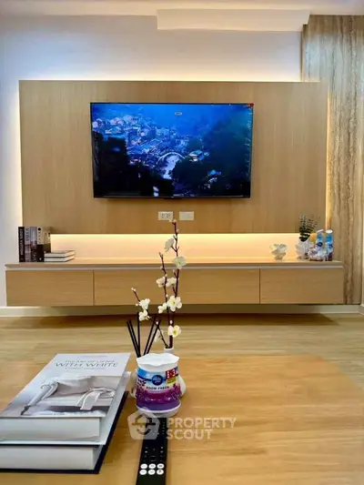 Modern living room with sleek wooden TV unit and stylish decor