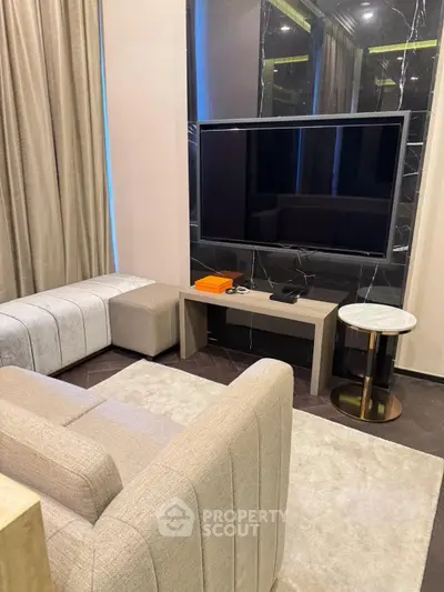 Luxurious modern living room with sleek TV setup and elegant furniture