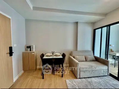 Modern living room with cozy sofa and dining area in stylish apartment