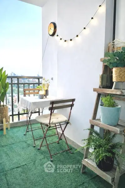 Charming balcony with cozy seating and lush greenery, perfect for relaxation.