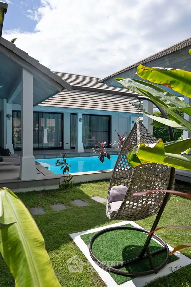 Luxurious villa with private pool and lush garden, perfect for relaxation and entertaining.