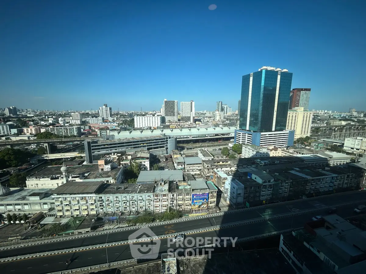 Stunning cityscape view from high-rise building showcasing urban skyline and architecture.