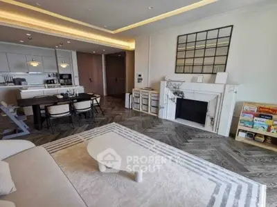 Luxurious open-plan living room with modern kitchen and elegant fireplace