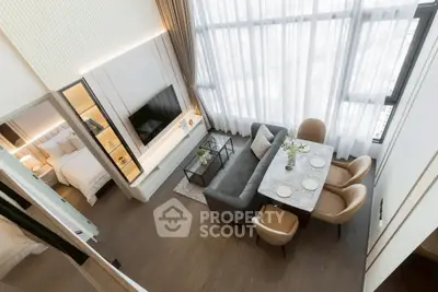 Luxurious modern living room with high ceilings and elegant dining area in a stylish apartment.